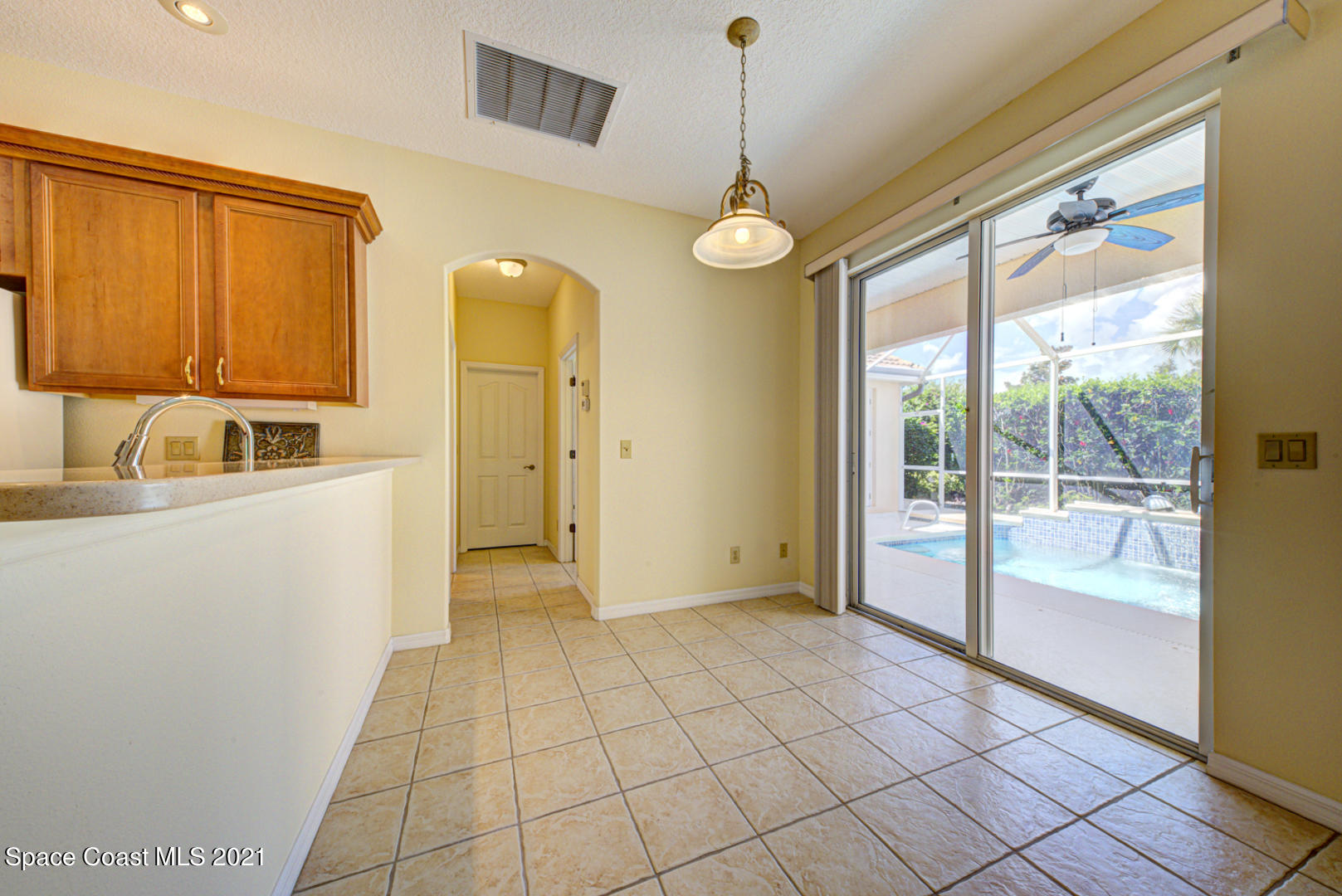 8206 Simpkins Way Melbourne, FL 32940 - Photo 24 of 66 breakfast nook with slider to pool (1)