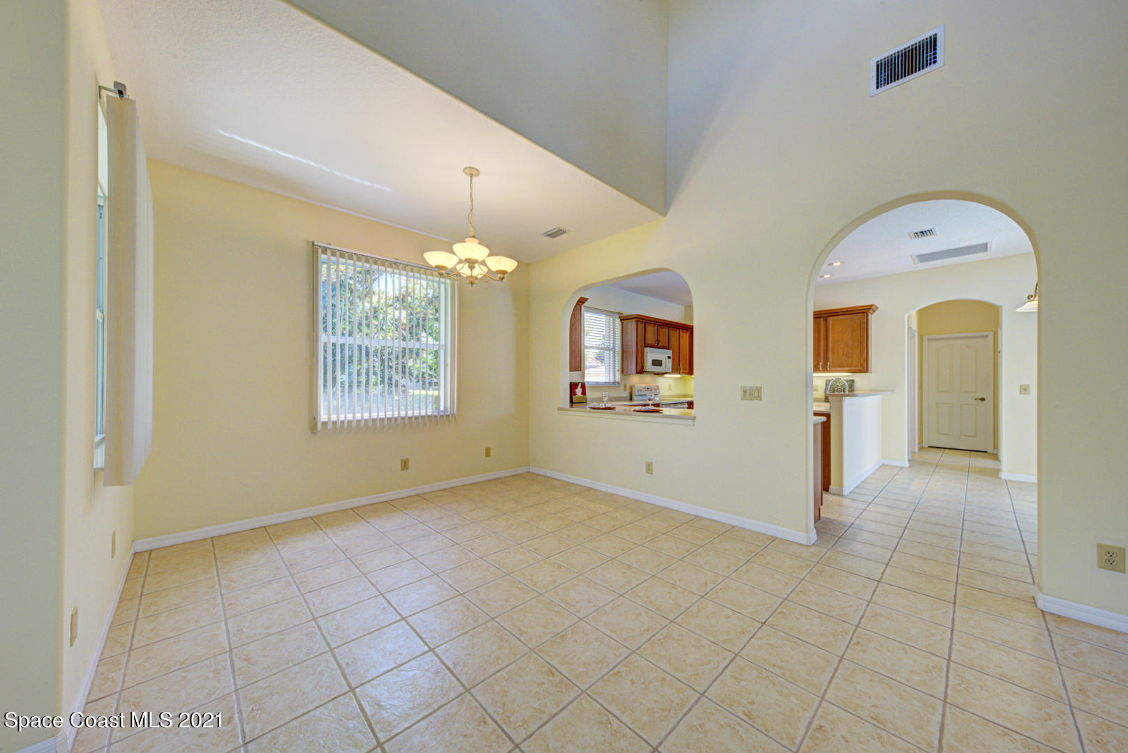 8206 Simpkins Way Melbourne, FL 32940 - Photo 31 of 66 dining room with arched opening (1)