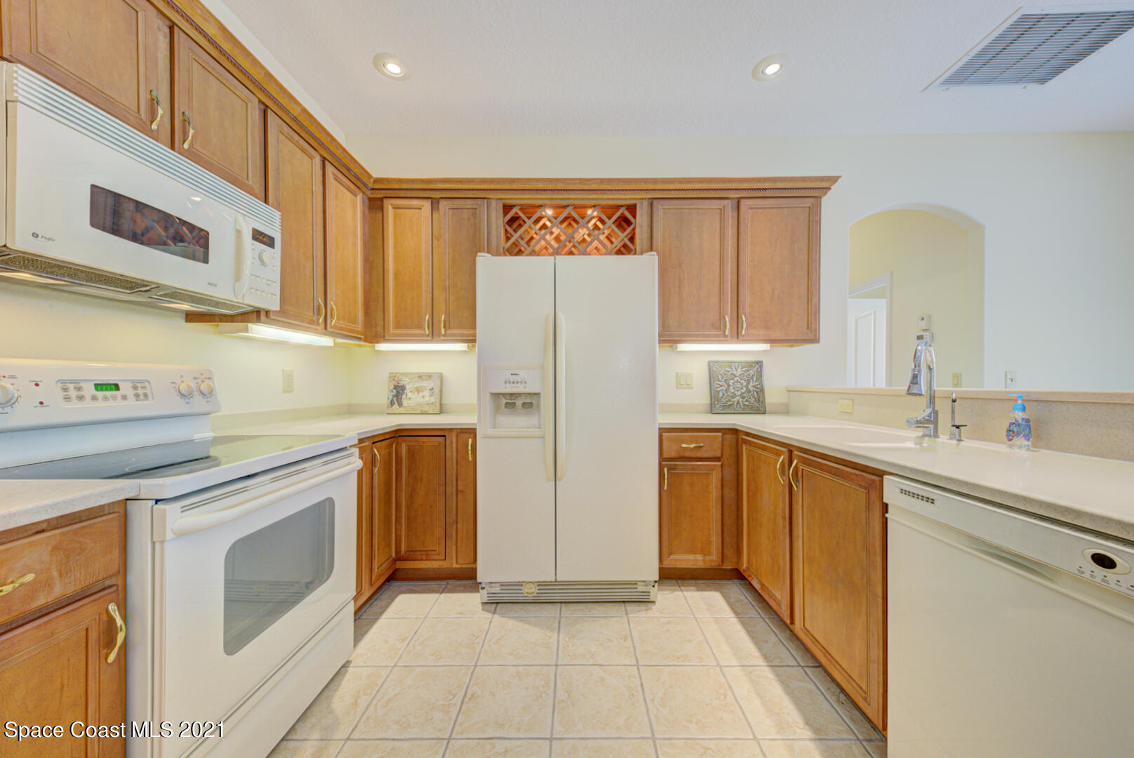 8206 Simpkins Way Melbourne, FL 32940 - Photo 36 of 66 kitchen with built-in wine rack