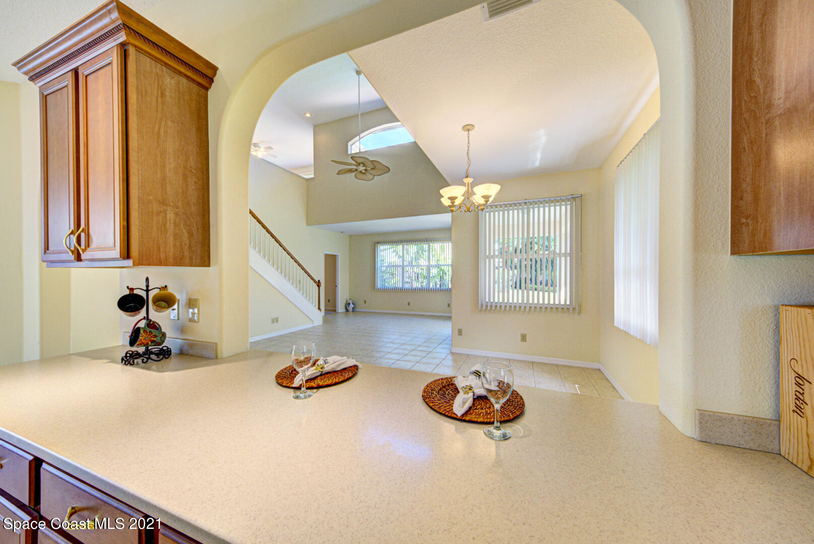 8206 Simpkins Way Melbourne, FL 32940 - Photo 37 of 66 kitchen with pass-thru to dining room