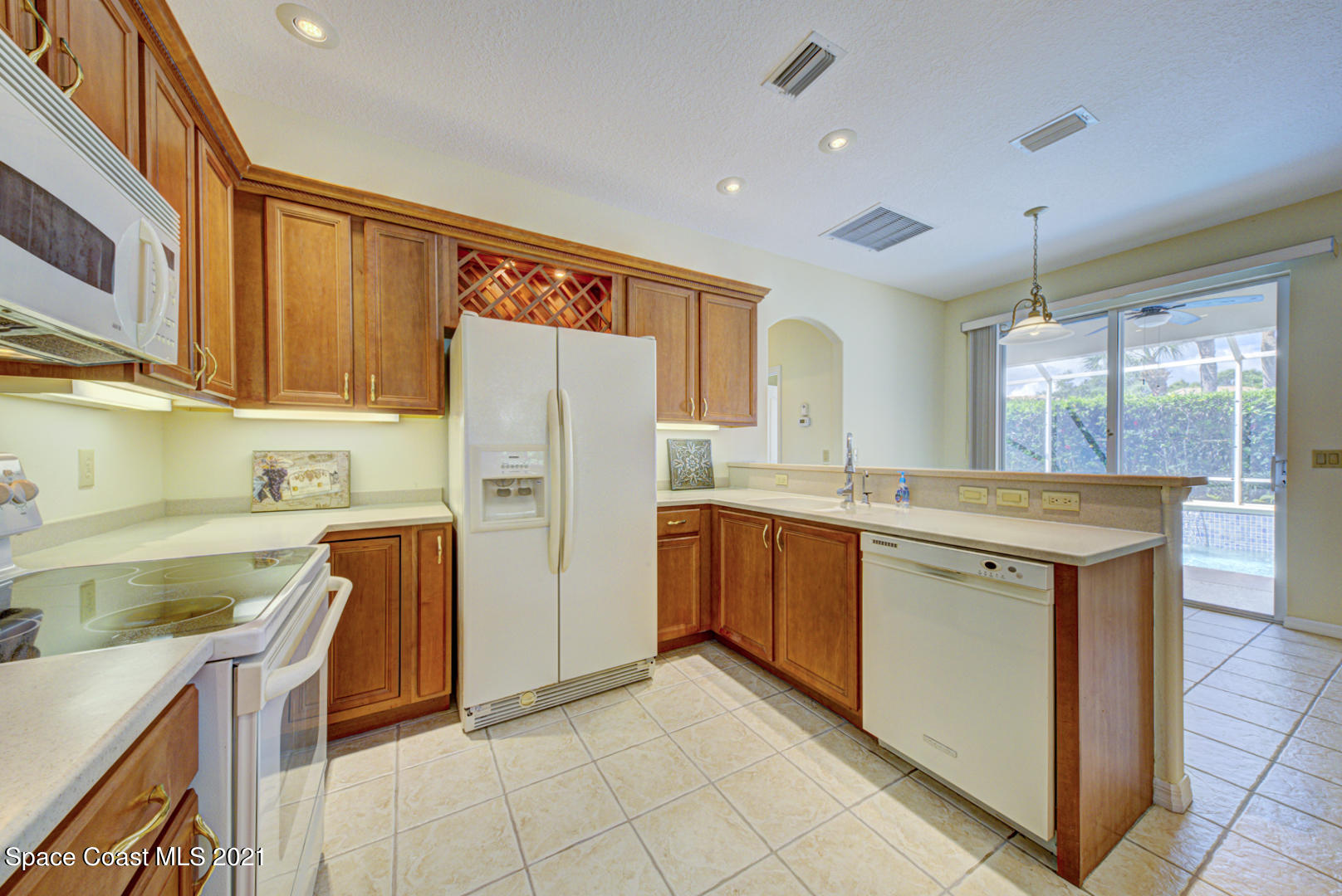 8206 Simpkins Way Melbourne, FL 32940 - Photo 39 of 66 kitchen with undercabinet lights