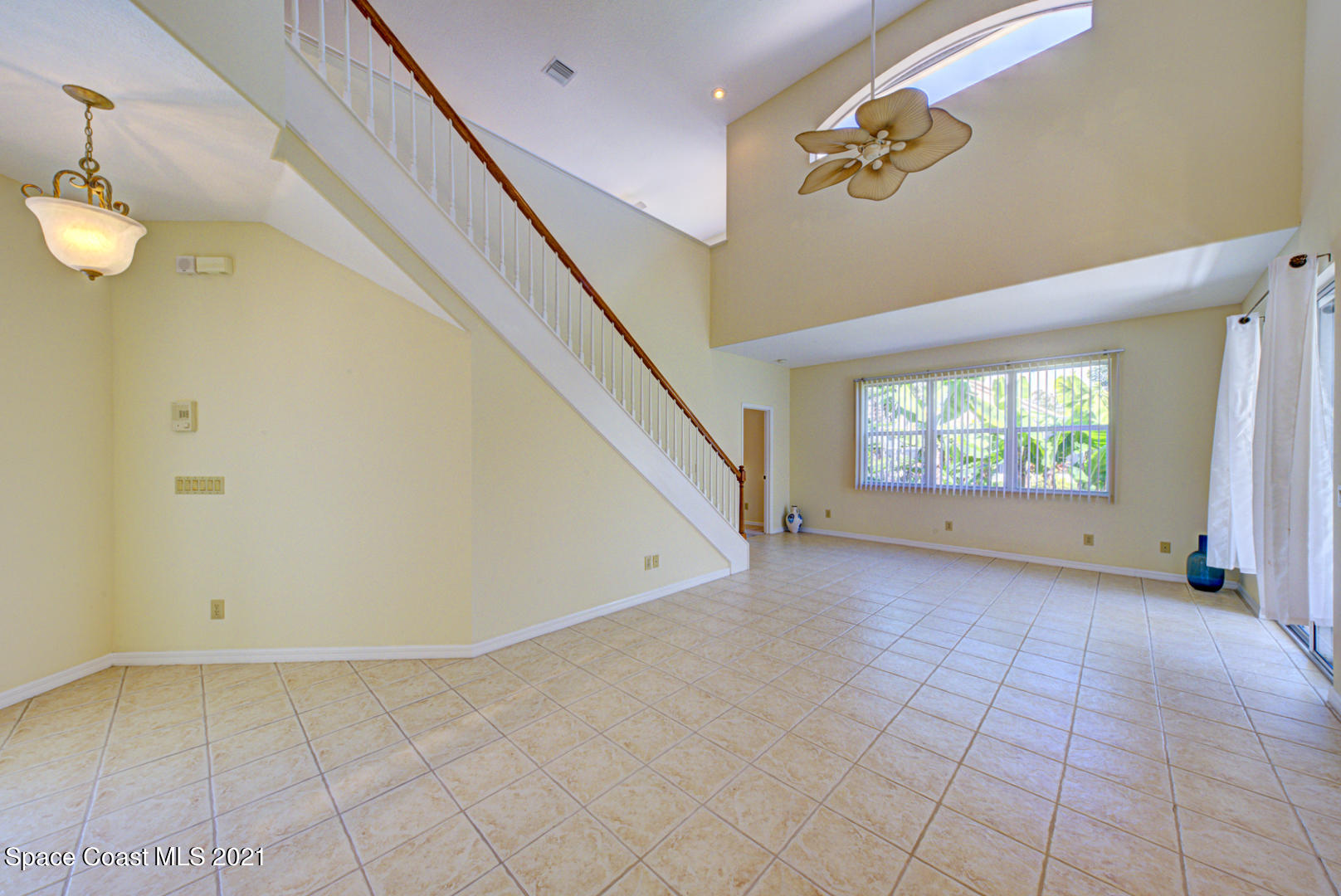 8206 Simpkins Way Melbourne, FL 32940 - Photo 5 of 66 living room & staircase (1)