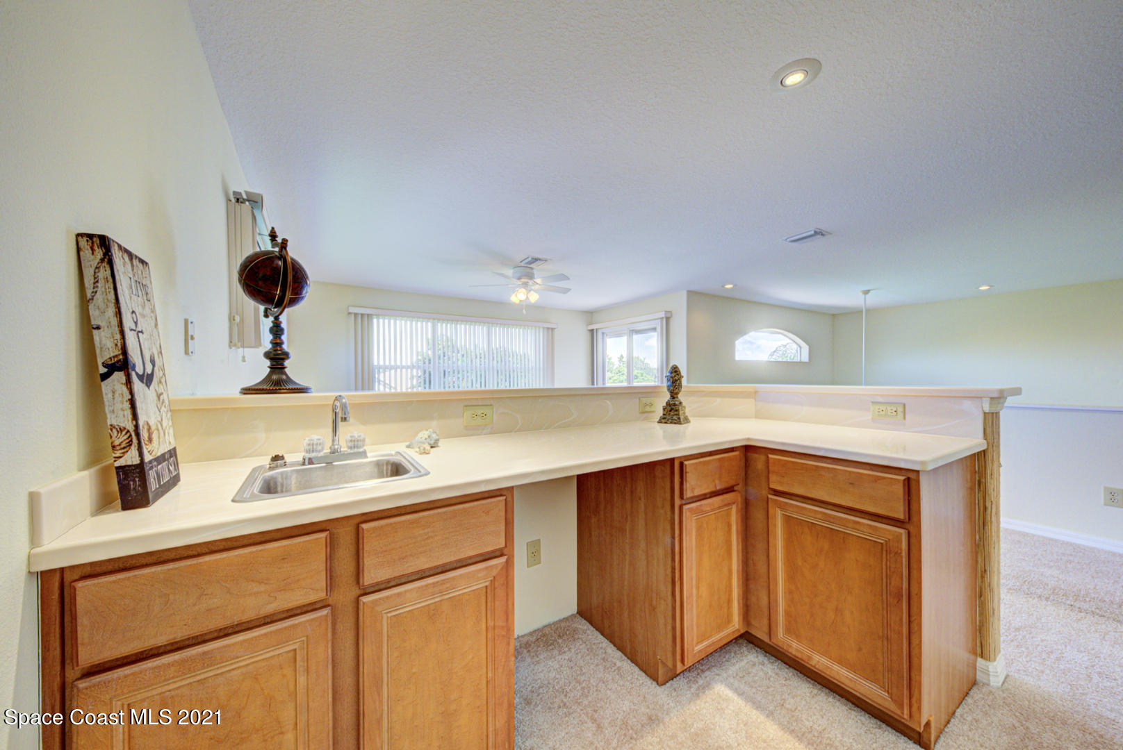 8206 Simpkins Way Melbourne, FL 32940 - Photo 59 of 66 second floor loft wet bar - Copy