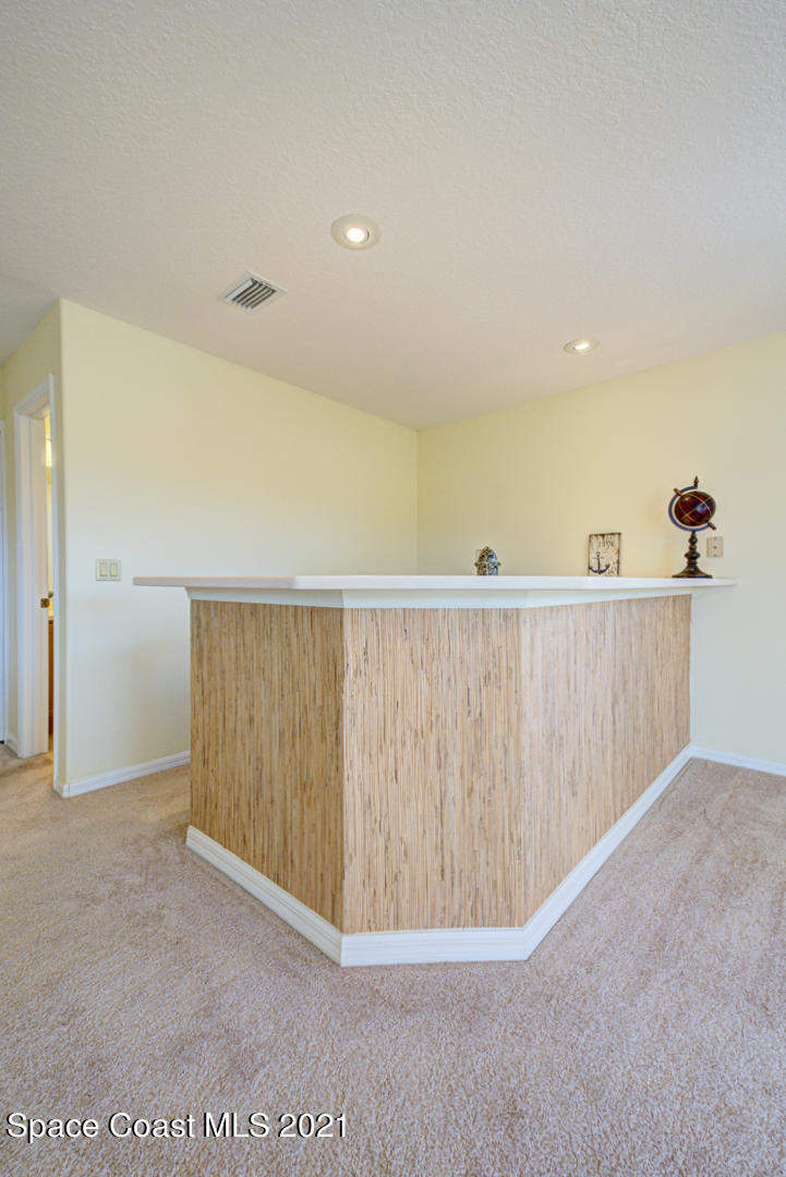 8206 Simpkins Way Melbourne, FL 32940 - Photo 60 of 66 second floor loft with bar - Copy - Copy