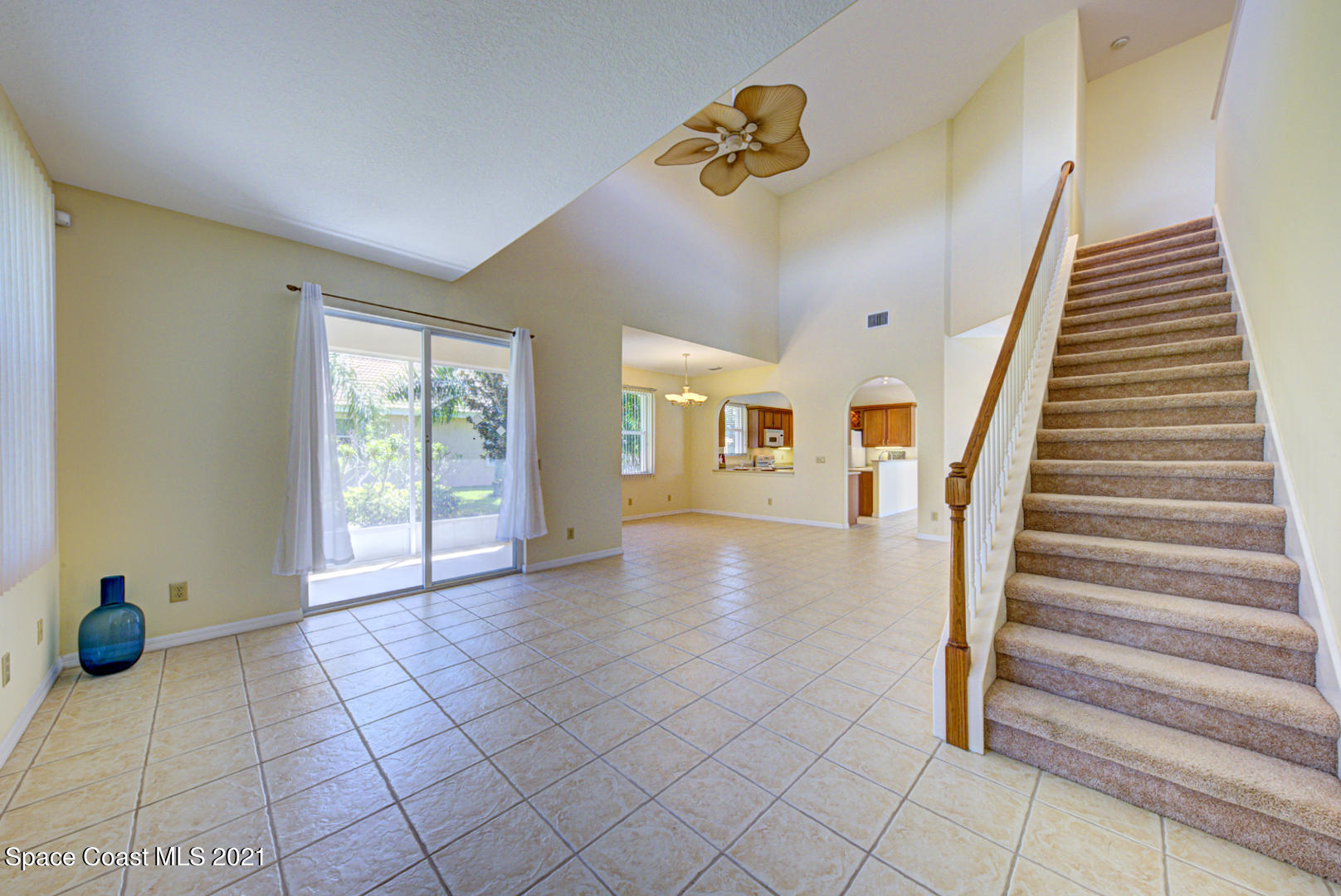 8206 Simpkins Way Melbourne, FL 32940 - Photo 7 of 66 living room with slider to porch