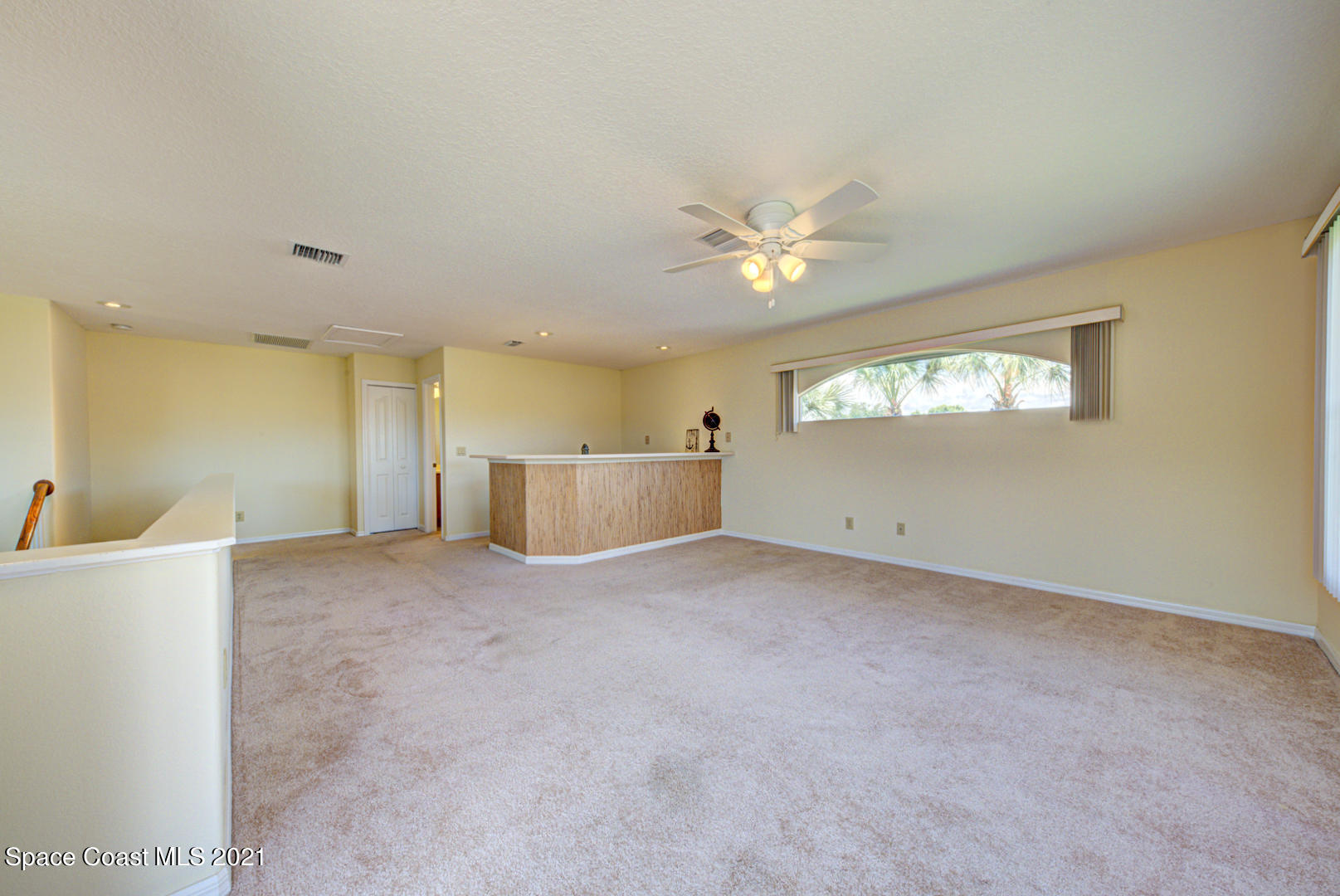 8206 Simpkins Way Melbourne, FL 32940 - Photo 62 of 66 second floor loft with carpet (1)