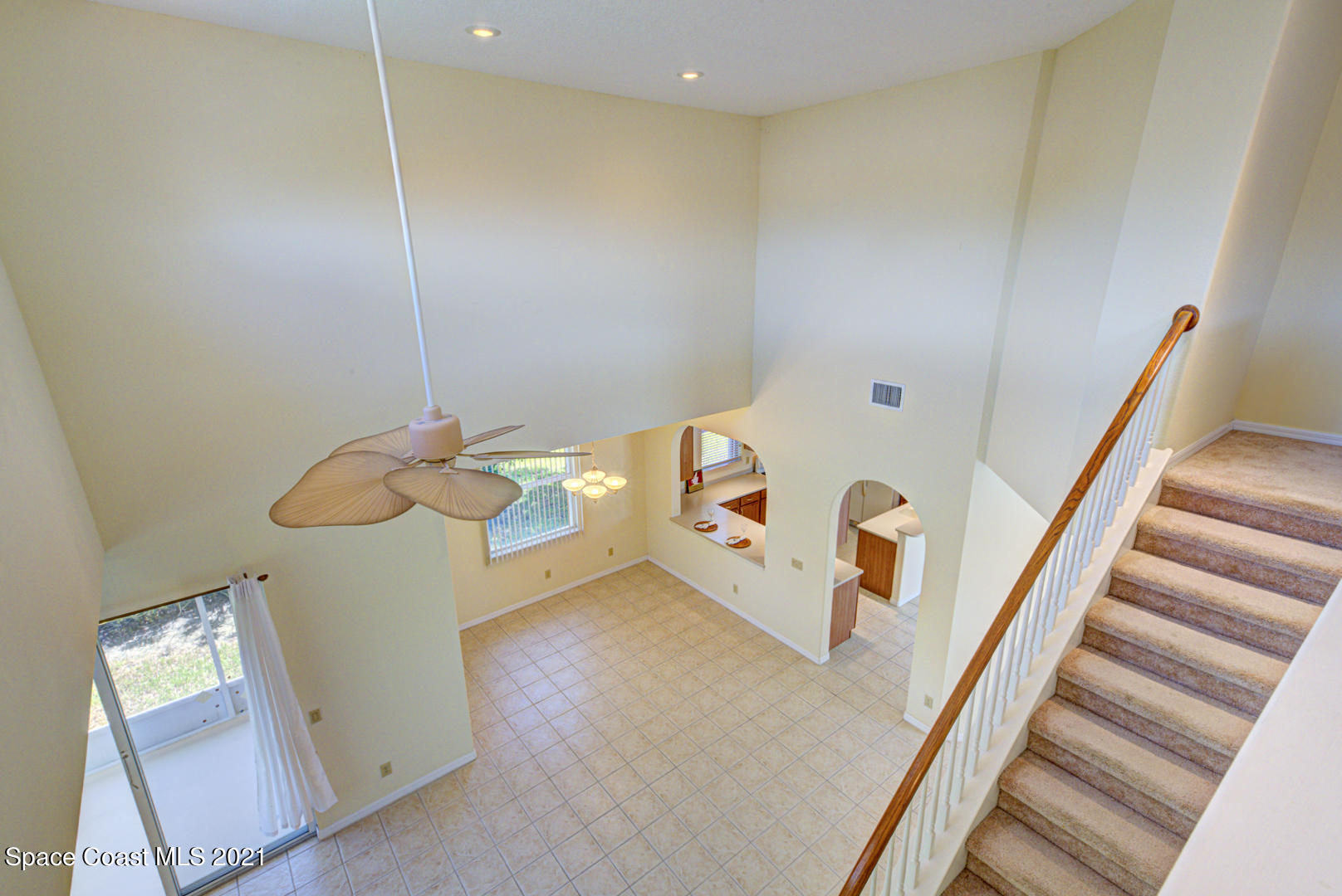 8206 Simpkins Way Melbourne, FL 32940 - Photo 9 of 66 view of dining room from loft (1)