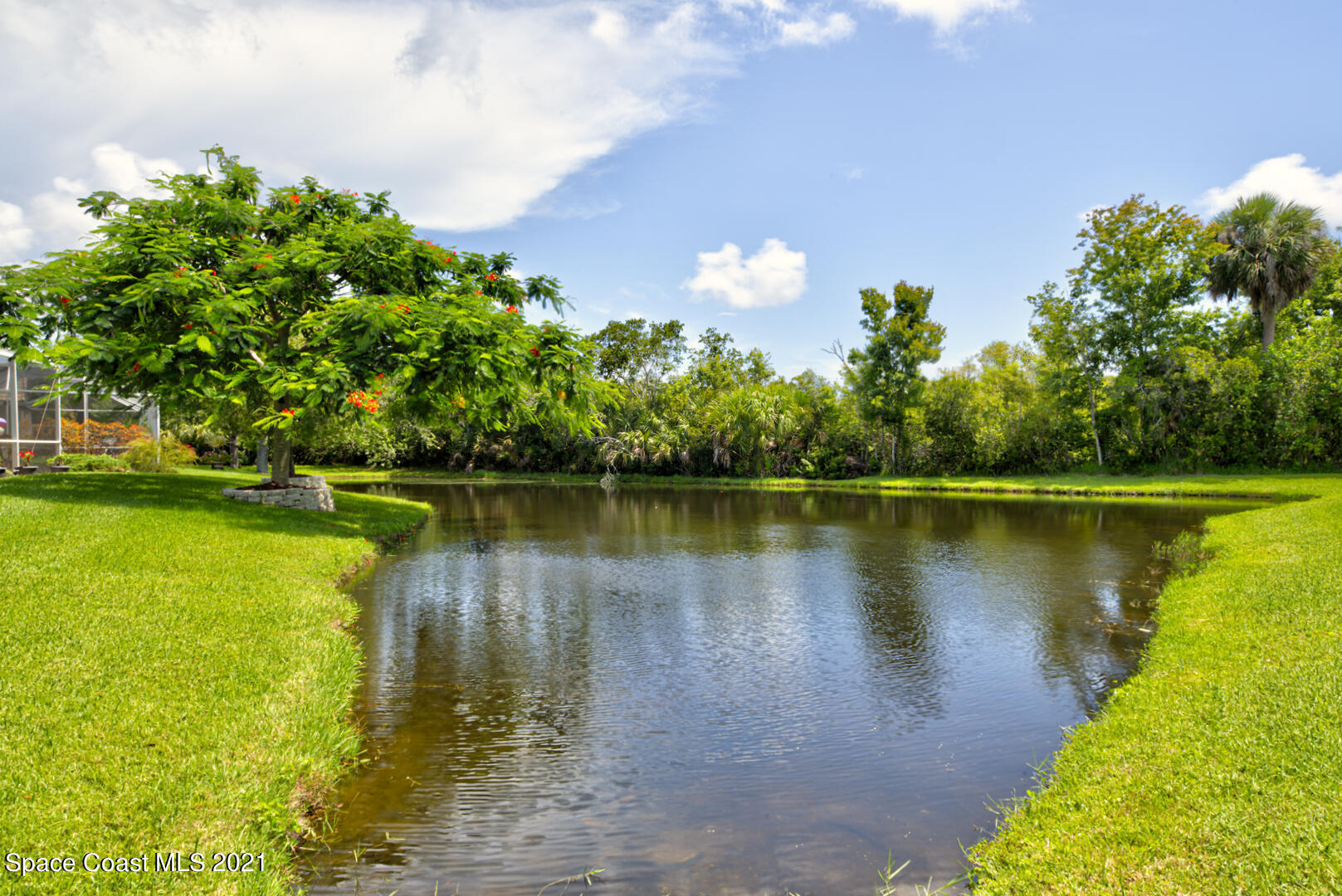 8206 Simpkins Way Melbourne, FL 32940 - Photo 10 of 66 backyard lake