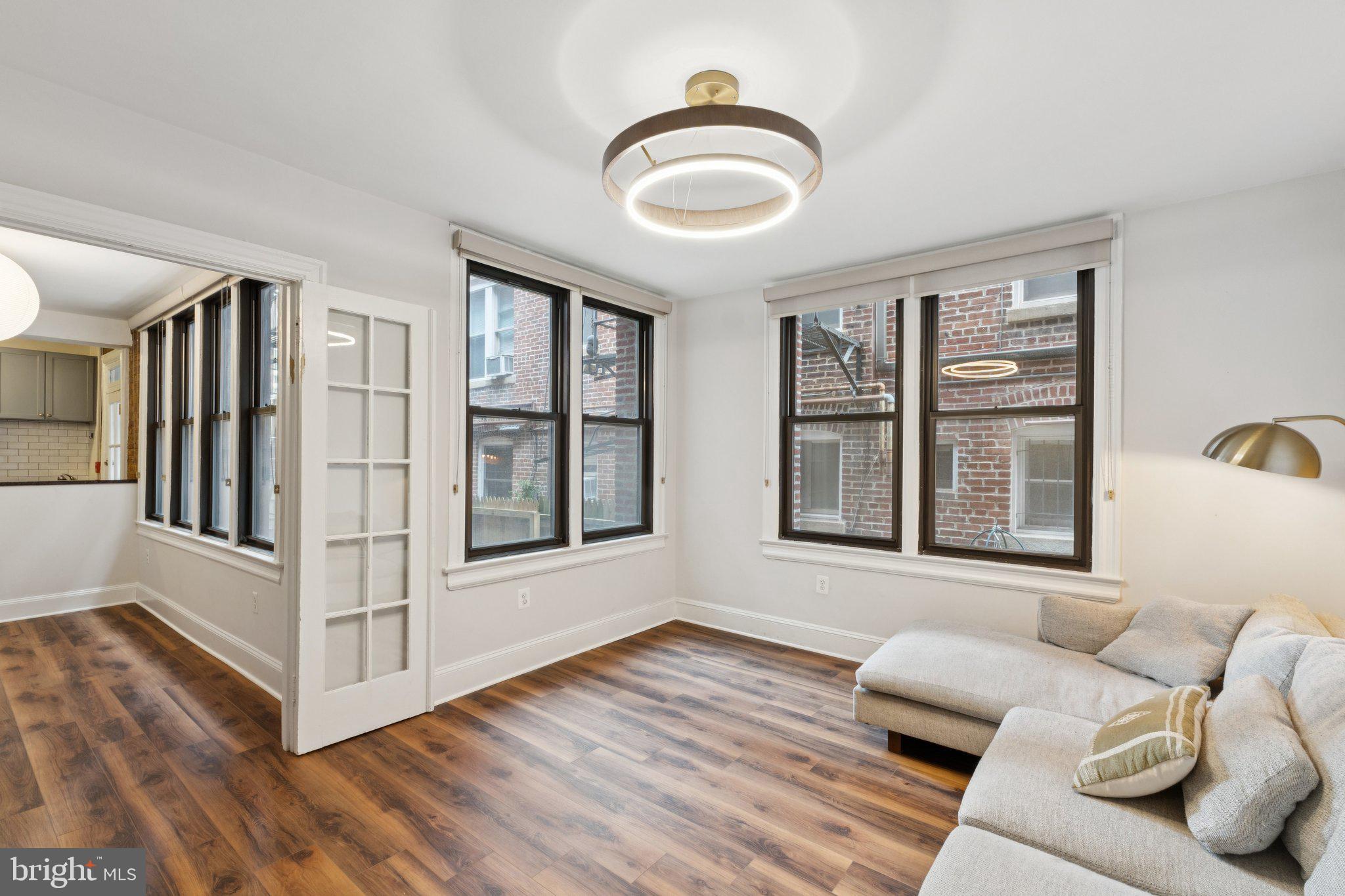 1858 California Street Northwest, Unit 5 Washington, DC 20009 - Photo 1 of 23 a view of livingroom with furniture and windows