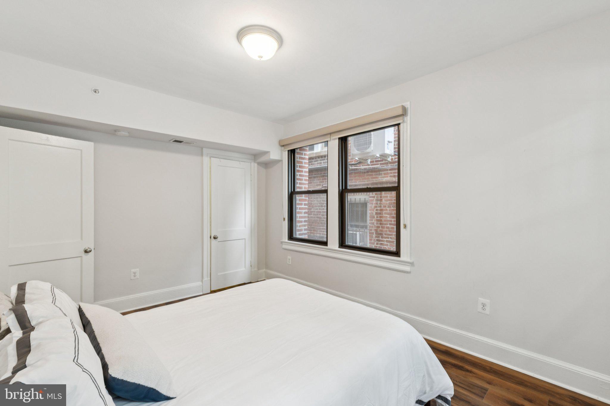 1858 California Street Northwest, Unit 5 Washington, DC 20009 - Photo 18 of 23 a bedroom with a bed and a window