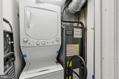 a bathroom with a toilet and a mirror