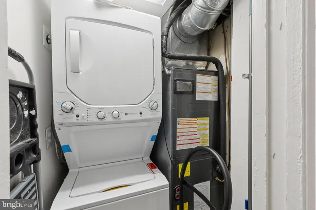 a bathroom with a toilet and a mirror