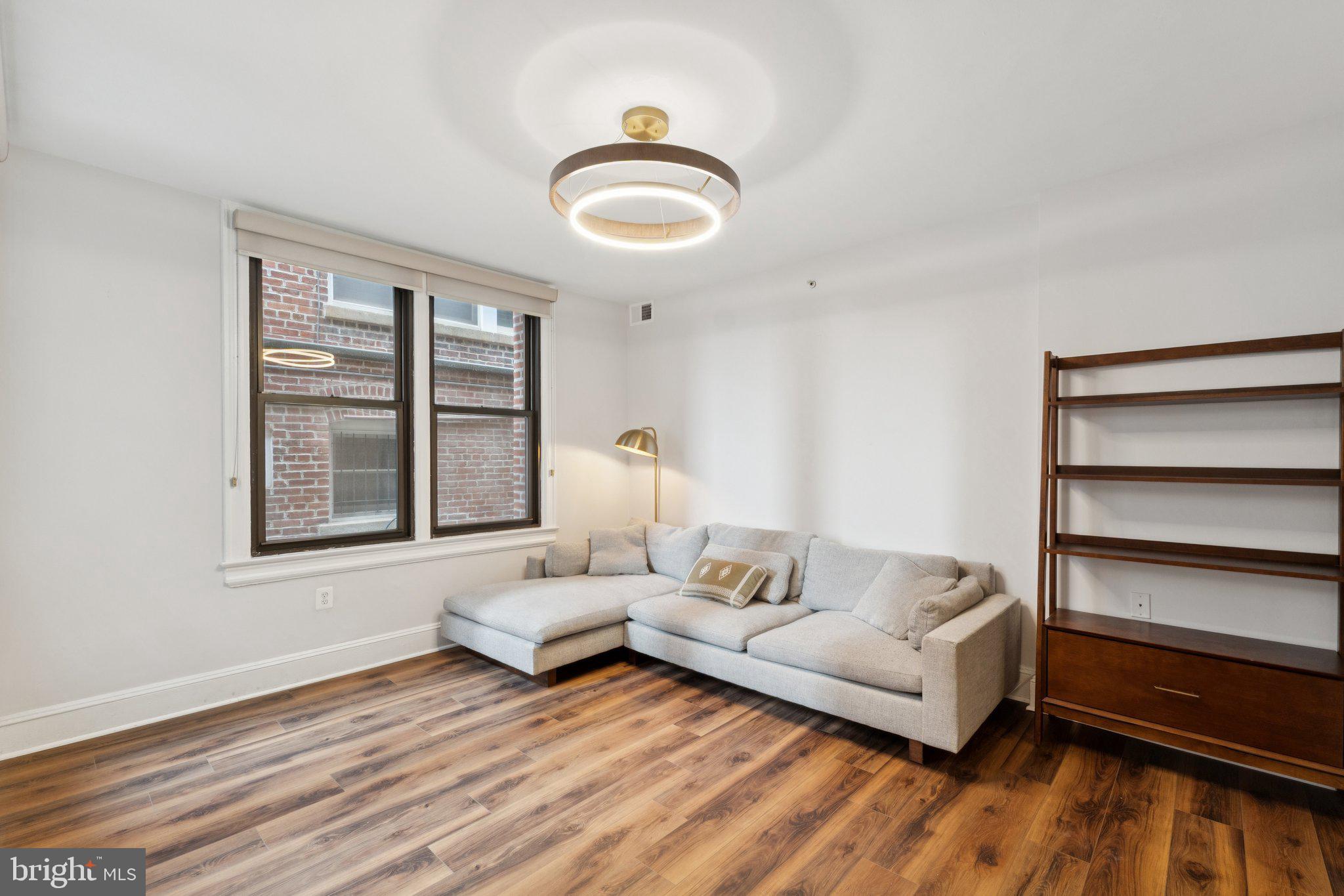 1858 California Street Northwest, Unit 5 Washington, DC 20009 - Photo 4 of 23 a living room with furniture and a large window