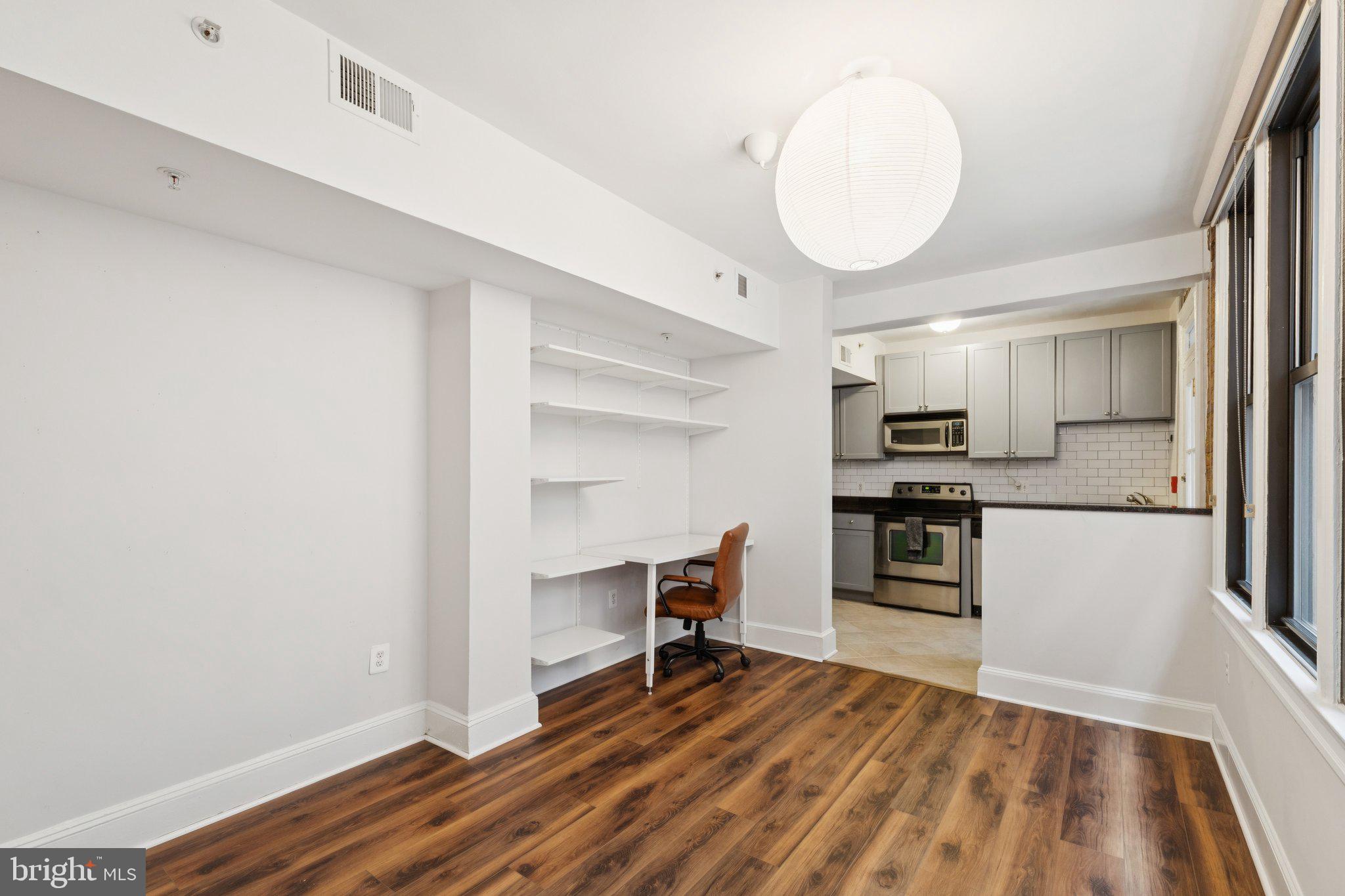 1858 California Street Northwest, Unit 5 Washington, DC 20009 - Photo 7 of 23 a view of kitchen and wooden floor