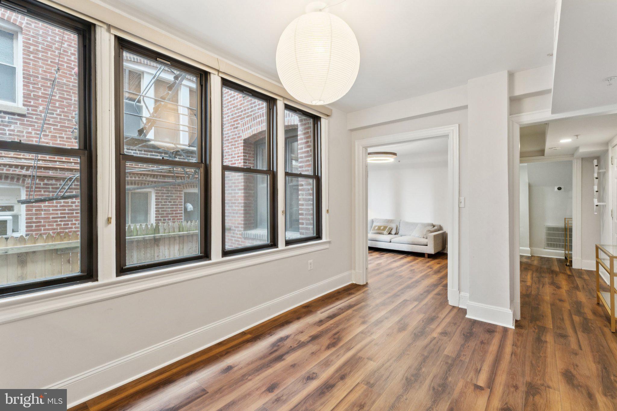 1858 California Street Northwest, Unit 5 Washington, DC 20009 - Photo 10 of 23 a view of a house with wooden floor and a window