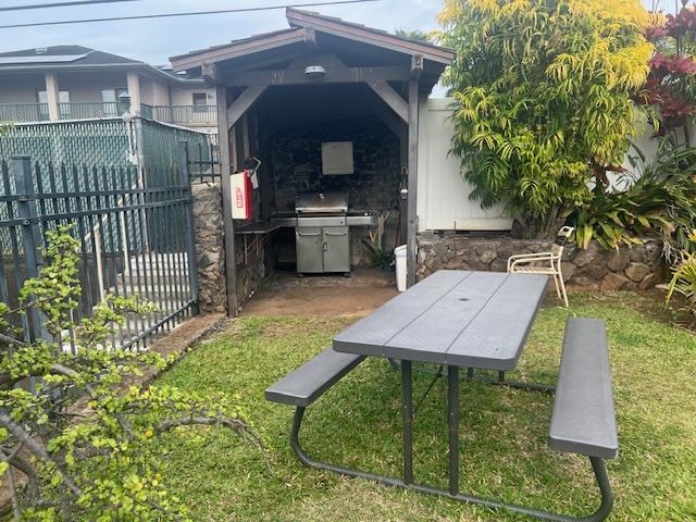 120 Hui Rd F, Unit I16 Lahaina, HI 96761 - Photo 23 of 28 a view of a backyard with a patio and a garden