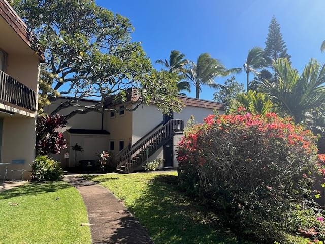 120 Hui Rd F, Unit I16 Lahaina, HI 96761 - Photo 4 of 28 a view of a house with a yard and garden