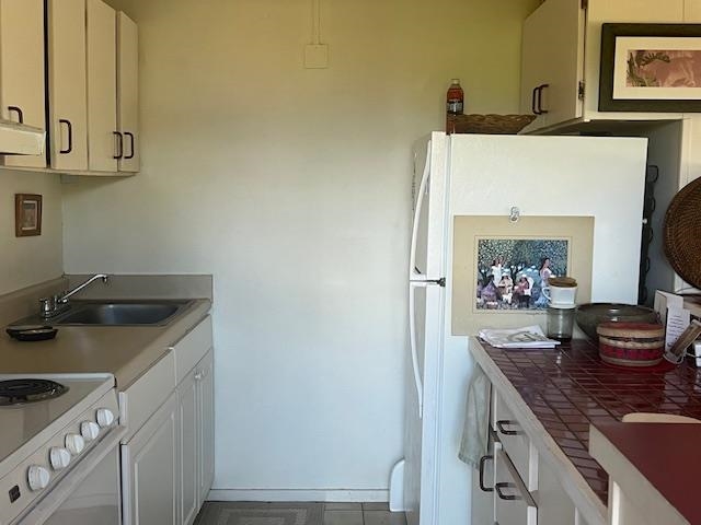120 Hui Rd F, Unit I16 Lahaina, HI 96761 - Photo 7 of 28 a kitchen with stainless steel appliances granite countertop a sink stove and cabinets