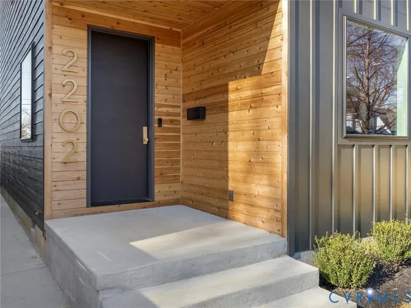 a bedroom with furniture and a large window