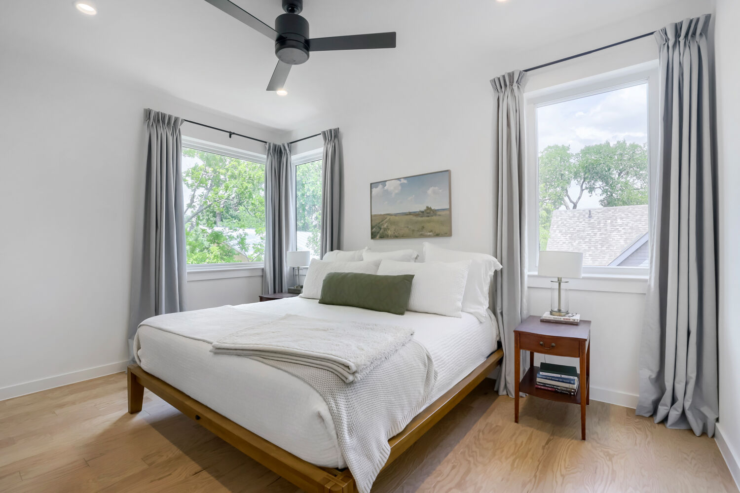 4804 Ribbecke Avenue, Unit A Austin, TX 78721 - Photo 14 of 32 This room features light hardwood flooring, a ceiling fan, and recessed lighting