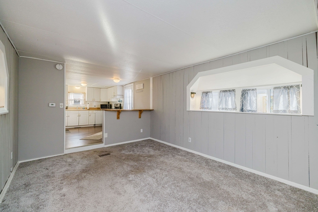 3040 Cranberry Highway, Unit 41 Wareham, MA 02538 - Photo 13 of 25 a view of a kitchen with a sink and dishwasher cabinets