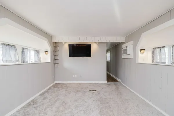 a view of empty room with windows