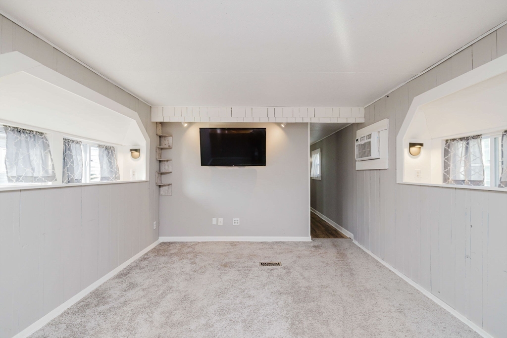 3040 Cranberry Highway, Unit 41 Wareham, MA 02538 - Photo 4 of 25 a view of empty room with windows