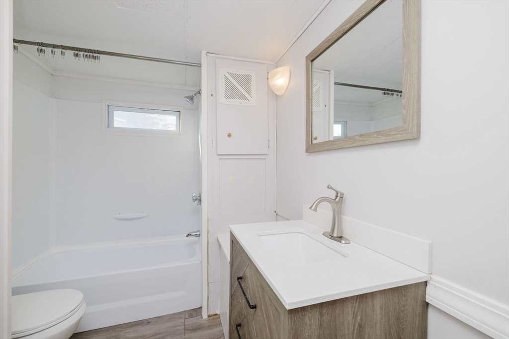 3040 Cranberry Highway, Unit 41 Wareham, MA 02538 - Photo 5 of 25 a bathroom with a sink toilet and shower