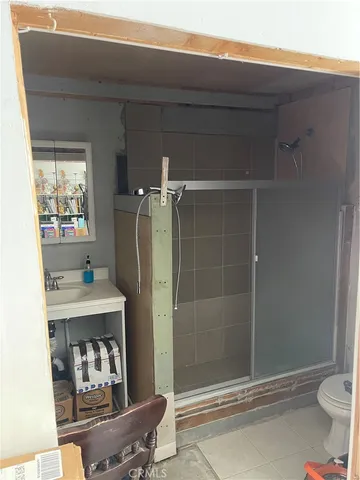 a bathroom with a toilet and shower