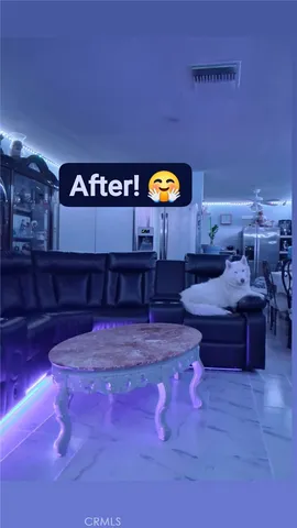 a lobby with furniture and sign