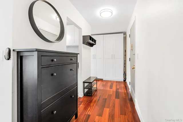 a view of a hallway with wooden floor