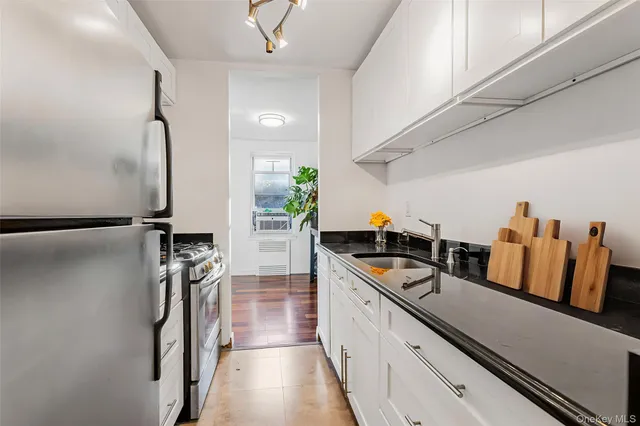 a kitchen with lots of counter top space and stainless steel appliances