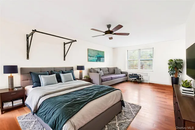 a bed room with bed and a window