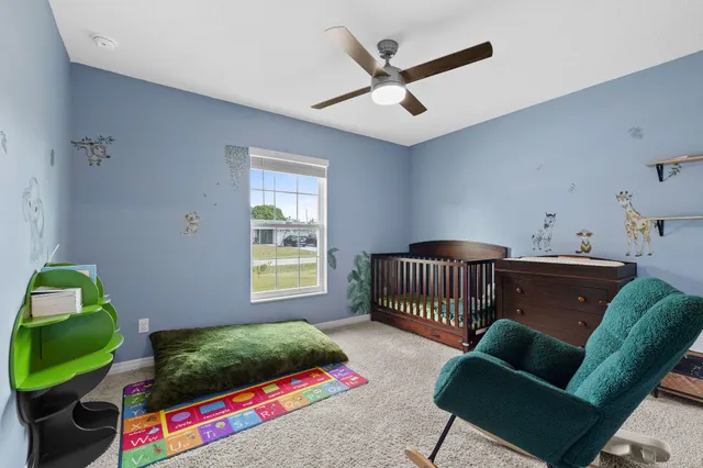 a bedroom with furniture and a window