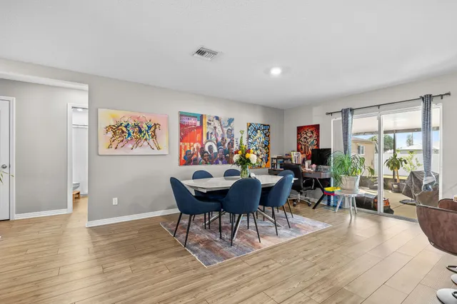 a view of a dining room with furniture window and outside view