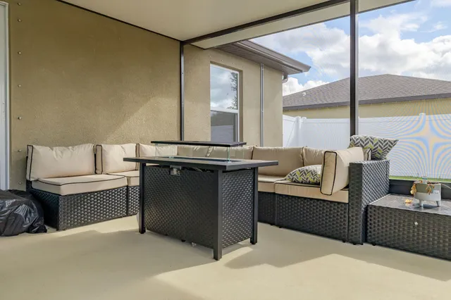 a living room with furniture and windows
