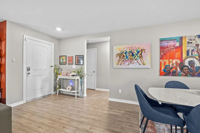 a view of a dining room with furniture wooden floor and window