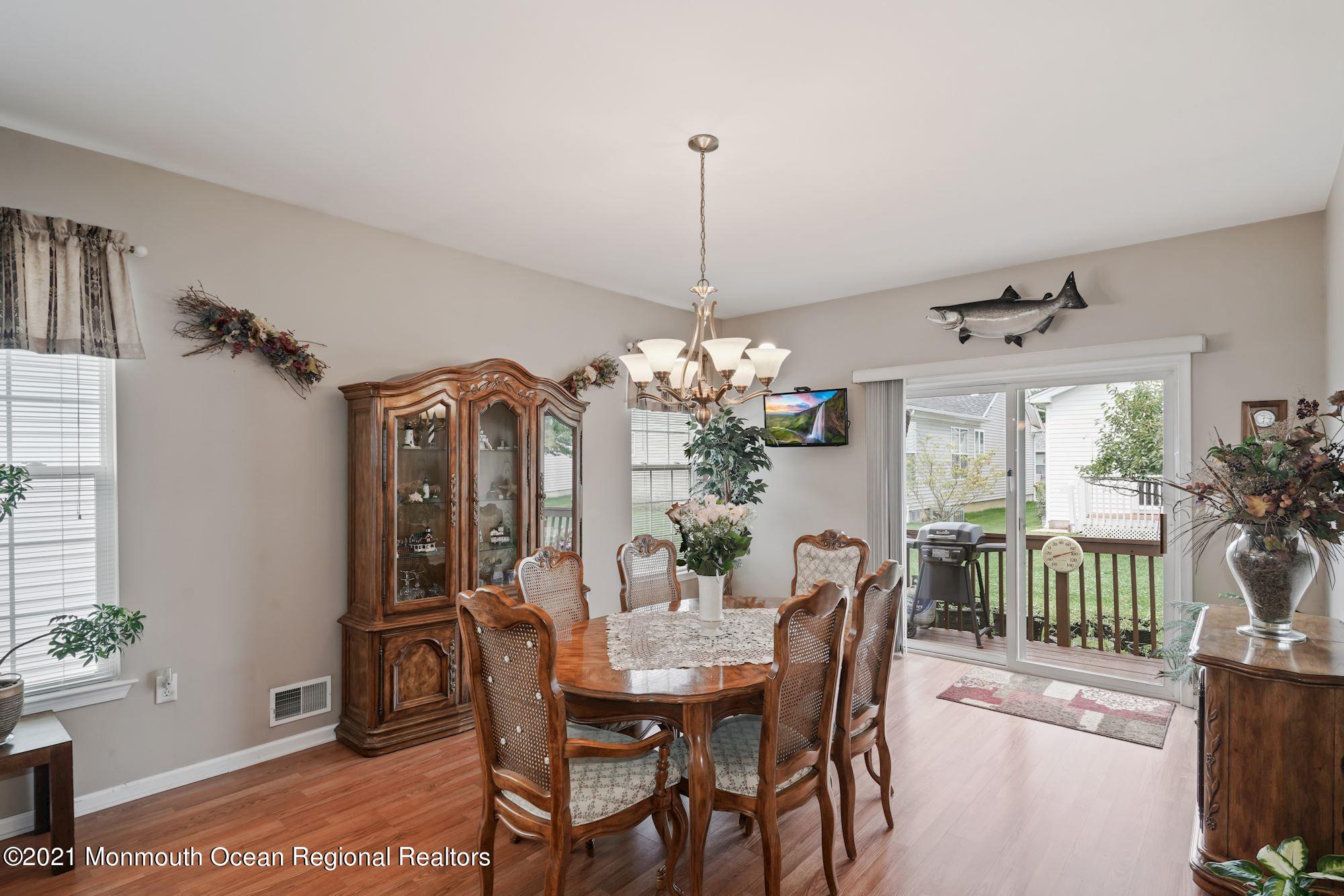 26 Shelley Road Brick, NJ 08724 - Photo 8 of 37 a dining room with furniture a chandelier and window