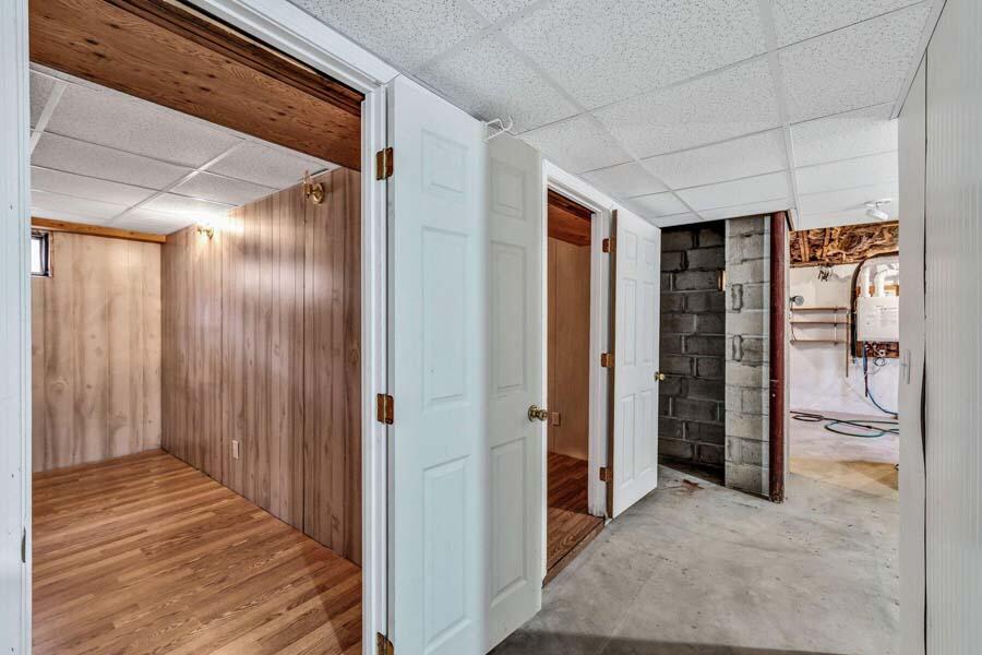 45 Manitoba Road Mashpee, MA 02649 - Photo 19 of 34 a view of a hallway with wooden shelves