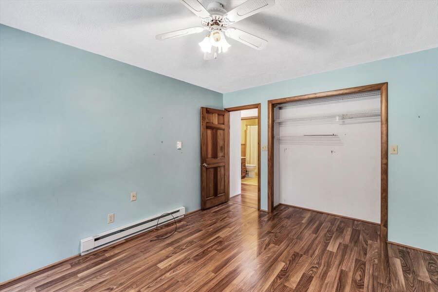 45 Manitoba Road Mashpee, MA 02649 - Photo 9 of 34 wooden floor in an empty room with a window