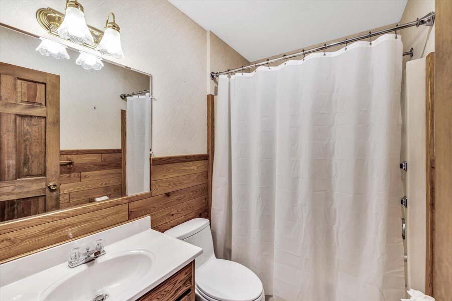 45 Manitoba Road Mashpee, MA 02649 - Photo 10 of 34 a bathroom with a sink vanity mirror and toilet