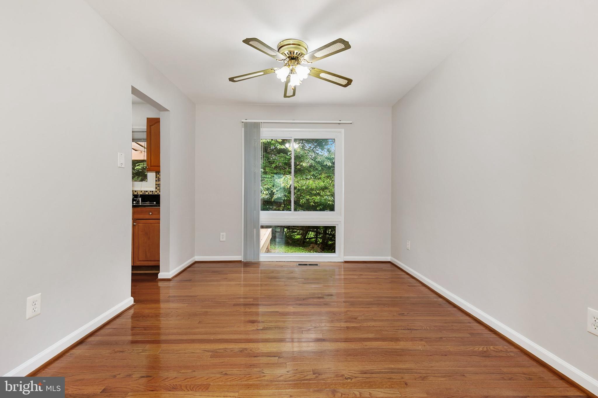 11501 Piney Lodge Road North Potomac, MD 20878 - Photo 18 of 64 wooden floor in an empty room with a window