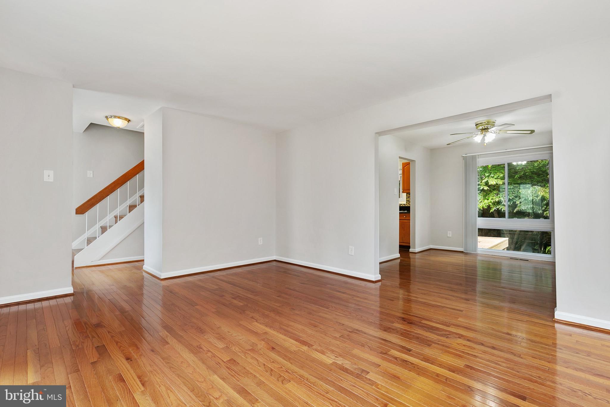 11501 Piney Lodge Road North Potomac, MD 20878 - Photo 20 of 64 a view of an empty room with wooden floor and a window