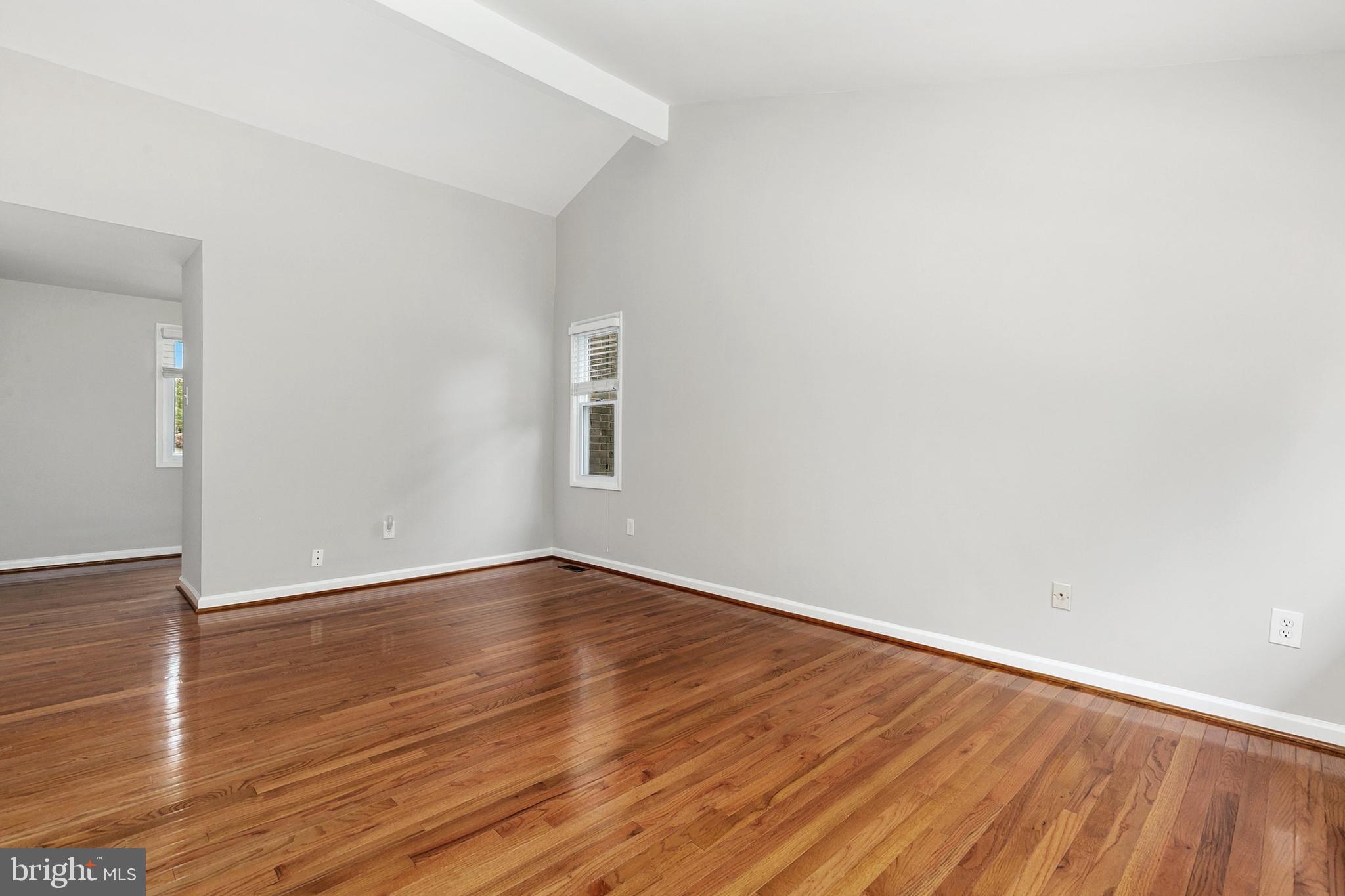 11501 Piney Lodge Road North Potomac, MD 20878 - Photo 24 of 64 a view of an empty room with wooden floor and a window