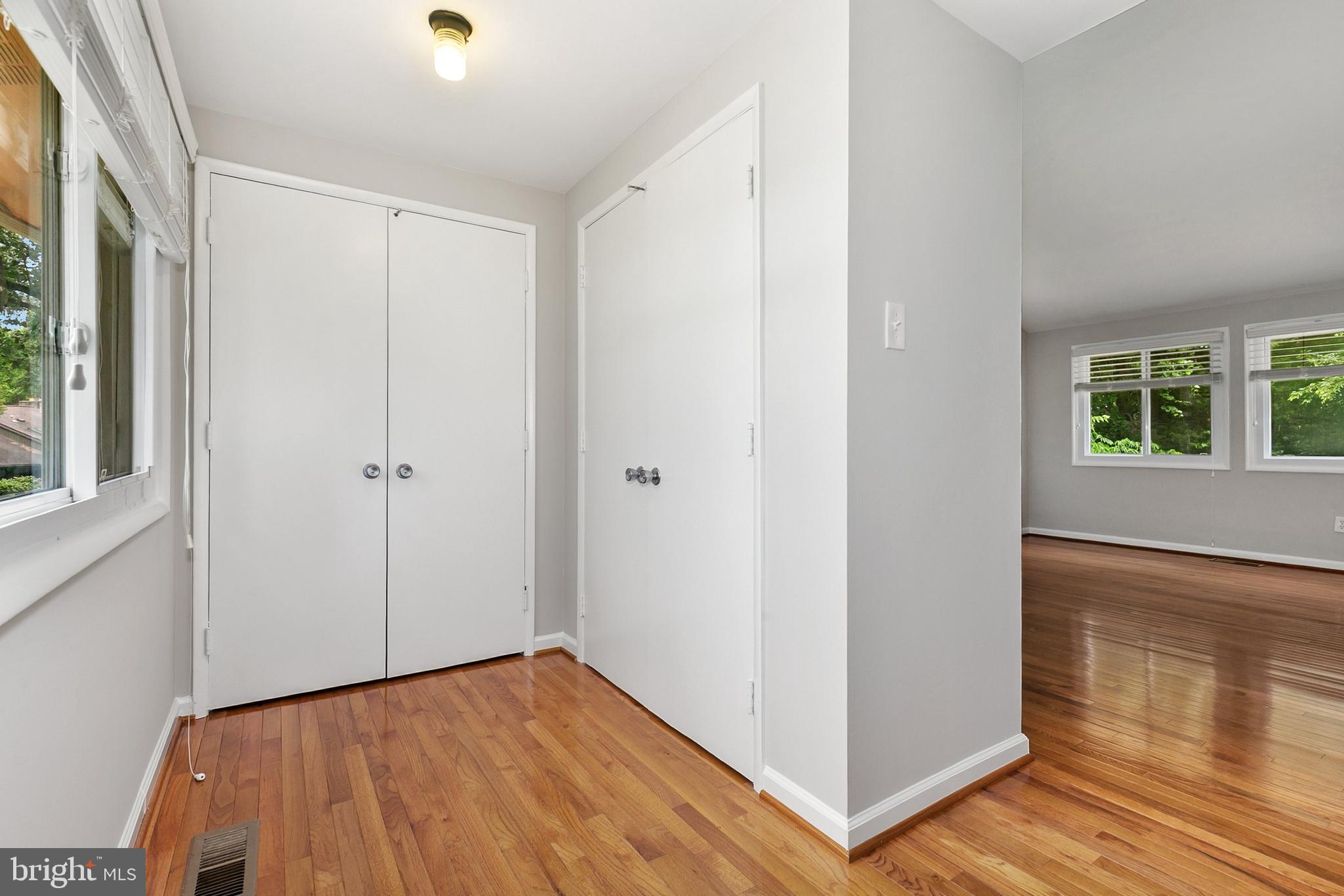11501 Piney Lodge Road North Potomac, MD 20878 - Photo 25 of 64 a view of hallway with window and wooden floor