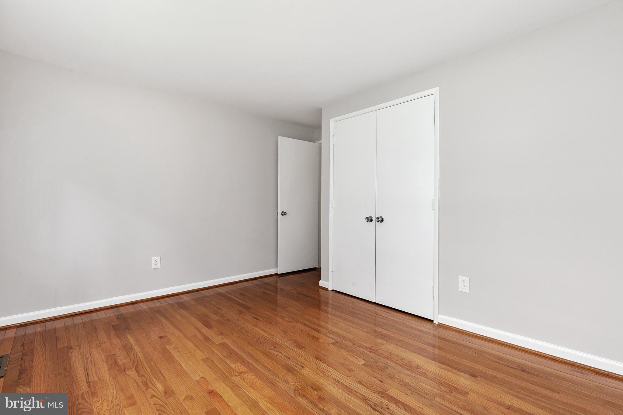 11501 Piney Lodge Road North Potomac, MD 20878 - Photo 32 of 64 a view of an empty room with wooden floor