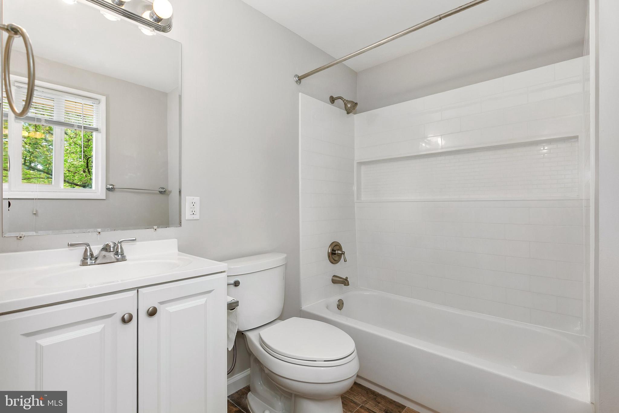 11501 Piney Lodge Road North Potomac, MD 20878 - Photo 33 of 64 a bathroom with a sink toilet and shower