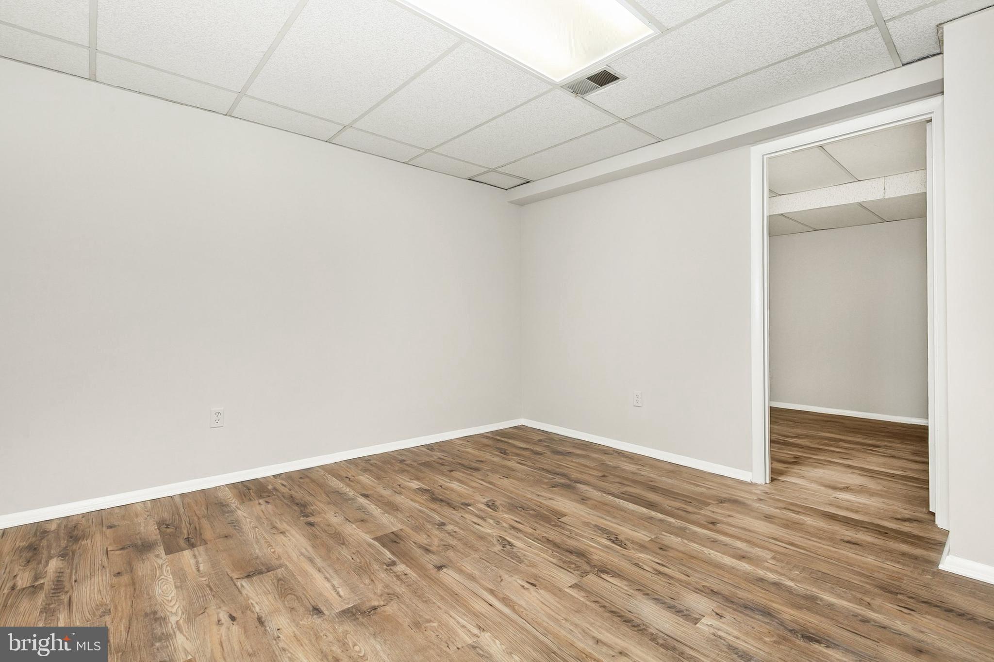 11501 Piney Lodge Road North Potomac, MD 20878 - Photo 37 of 64 a view of a room with wooden floor