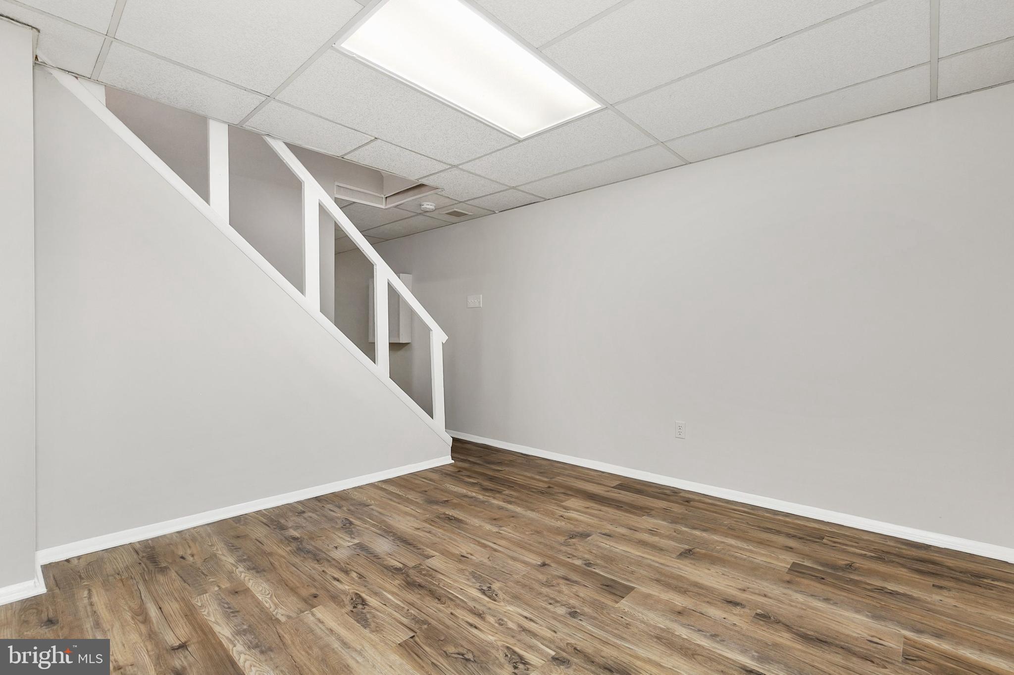11501 Piney Lodge Road North Potomac, MD 20878 - Photo 39 of 64 a view of an empty room with wooden floor