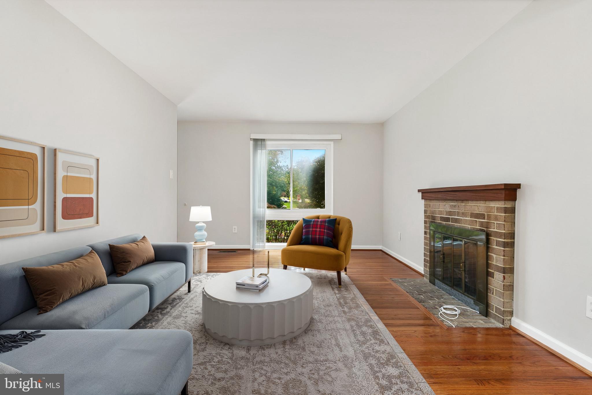 11501 Piney Lodge Road North Potomac, MD 20878 - Photo 57 of 64 a living room with furniture and a fireplace